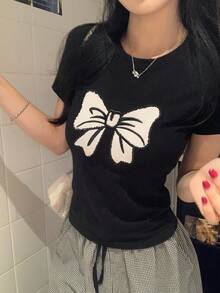 DAZY Camiseta casual de mujer de manga corta con cuello redondo y estampado de lazo - Negro - Ver 6