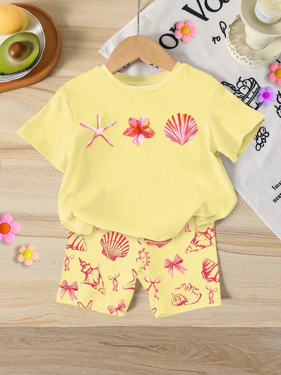SHEIN 2pcs/Set Baby Girls' Pink And Yellow Summer Cute Vacation Holiday Outfit,Short Sleeve Sea Creature Shell Bow Print T-Shirt & Bike Shorts,Korean Style - Multicolor - View 1