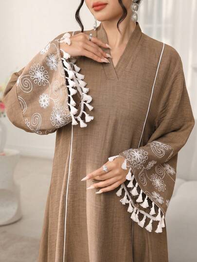Al Najma Áo tunic dáng rộng, thoải mái, kiểu retro, thêu họa tiết tua rua ở tay áo và váy dài truyền thống dành cho nữ.