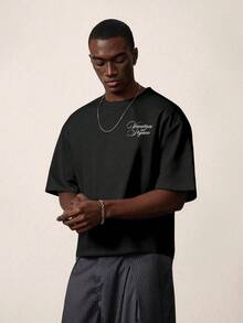 STYNVO Áo thun nam vai trễ tay ngắn cổ tròn dáng rộng oversize phong cách casual in họa tiết đa năng mặc hàng ngày, màu đen, cho mùa hè đi chơi nghỉ dưỡng - màu đen - Xem 2