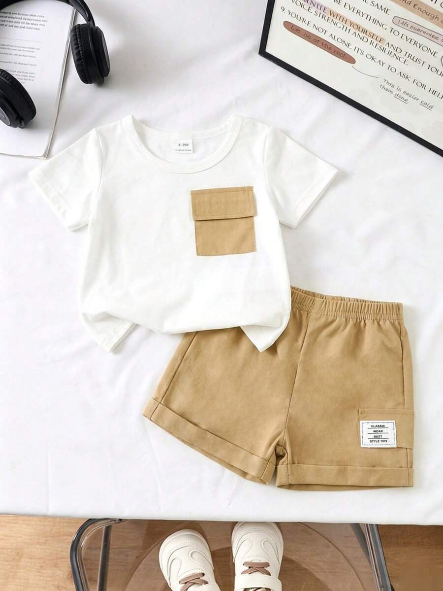 SHEIN Playful Pals Bộ 2 món unisex cho bé sơ sinh và trẻ nhỏ từ 0-3 tuổi, gồm áo tay ngắn cổ tròn và quần short cạp chun, thích hợp cho các hoạt động thể thao ngoài trời, đi chơi, mua sắm và du lịch. Phù hợp cho bé trai/bé gái từ 6 tháng đến 2-3 tuổi. - Màu Khaki - Xem 1