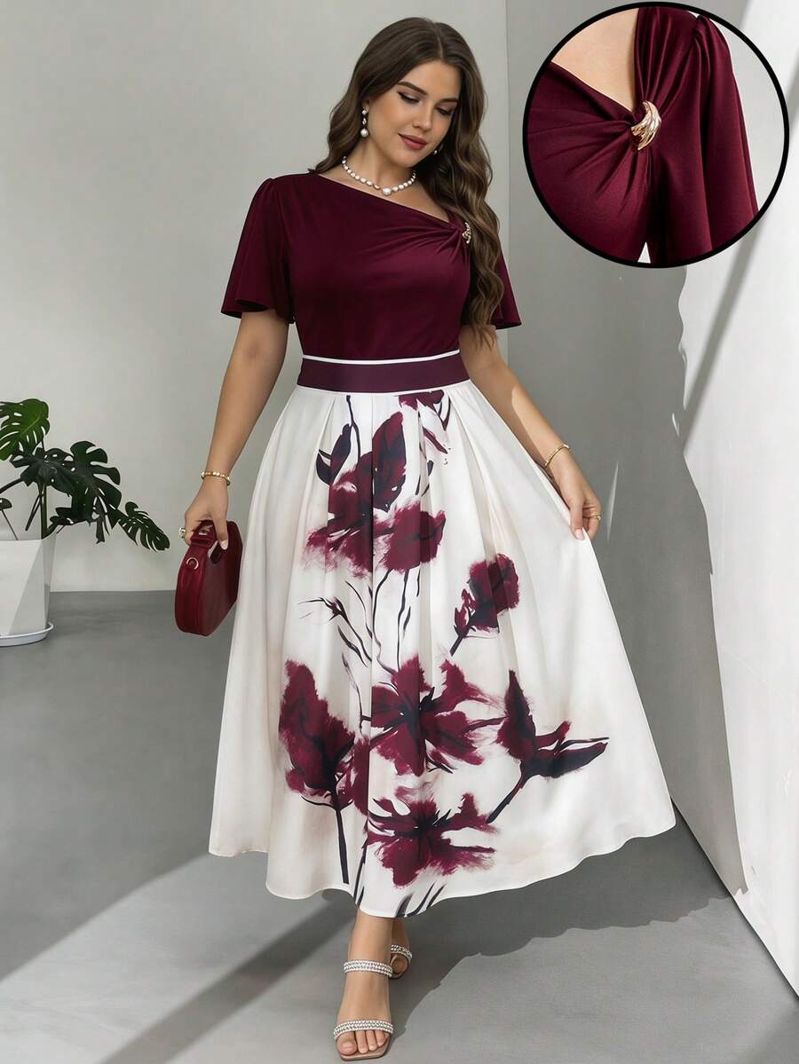 Modelyn Bộ đồ 2 món thanh lịch dành cho nữ cỡ lớn, màu trơn, trang trí kim loại, cổ áo bất đối xứng, tay ngắn và chân váy midi in hoa.