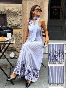 Modelyn 女士优雅印花不对称露背连衣裙，肩部系带，尽显淑女风范，A字荷叶边下摆，适合休闲穿着、社交聚会、旅行、宴会等各种场合。 - 紫色 - 查看 7