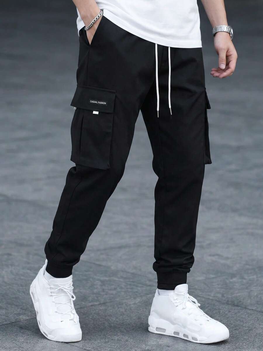 Manfinity Roghcode Men's Solid Color Slant Pocket Drawstring Waist Casual Cargo Pants - Black - View 1