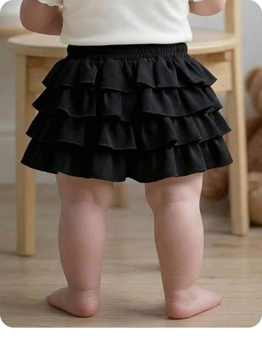 SHEIN Falda mini negra con volantes y cintura elástica, estilo casual y versátil para vacaciones de verano; shorts negros con volantes para niña bebé - Negro - Ver 1