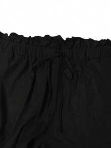 GlowEve CURVE Calça feminina plus size com efeito amassado, modelagem minimalista e solta, estampa floral em patchwork, ideal para a primavera/verão. Versátil para o dia a dia e para ir ao trabalho. - Preto - Ver 4
