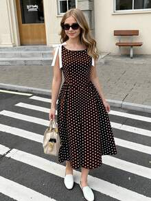 SHEIN Đầm không tay ôm eo màu đen trắng sang trọng, cao cấp, thời trang với điểm nhấn nơ tương phản, phù hợp cho tiệc tùng, du lịch, nghỉ dưỡng, đi biển và các dịp khác. - Nhiều màu - Xem 4