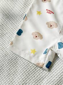 SHEIN Playful Pals 男婴夏季米色可爱卡通小狗和星星字母印花背带短裤，宽松版型，适合日常外出、家庭聚会、户外玩耍和拍照。 - 卡其色 - 查看 7