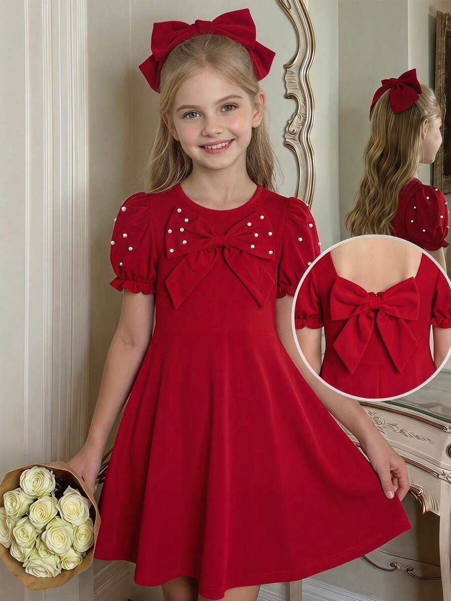 SHEIN Đầm Giáng sinh thanh lịch cho bé gái tuổi teen, chân váy đỏ tay phồng đính hạt cườm và nơ, kiểu dáng ngọt ngào và cao cấp, phù hợp cho mùa xuân hè và các dịp lễ hội. Điểm nhấn của thiết kế là tay phồng và nơ ở cổ áo, tăng thêm vẻ nữ tính; đính ngọc trai/hạt cườm, tôn lên vẻ tinh tế; dáng suông và chân váy dài vừa phải, giúp tôn dáng và che khuyết điểm. - Đỏ - Xem 1