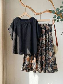 Rusticease Conjunto informal de 2 piezas de talla grande para mujer con camisa de manga raglán de unicolor y falda evasé con estampado floral - Negro - Ver 2
