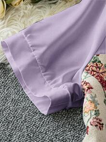 Rometta Plus Size Women's Elegant A-Line Short Sleeve Waist Cinched Vintage Jacquard Asymmetric Color Block V-Neck Peplum Top - Purple - View 3
