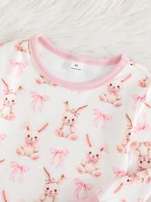 Cozy Pixies Bộ đồ ngủ hai mảnh cho bé gái, gồm áo dài tay cổ tròn mềm mại và quần dài cạp chun, họa tiết thỏ và nơ, thích hợp mặc ở nhà, đi nghỉ mát, lễ Phục Sinh, mặc nhiều lớp và nhiều dịp khác. - Nhiều màu - Xem 3