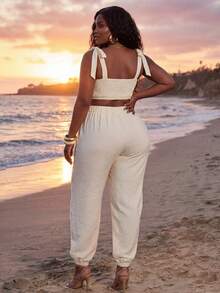Veslaya Bộ jumpsuit cỡ lớn dành cho nữ mùa Xuân/Hè 2026, thích hợp cho các dịp lễ hội âm nhạc, Lễ Phục Sinh, Phong cách miền Tây, Du mục, Tiệc sinh nhật, Lễ tốt nghiệp, Đại học, Sinh viên, Thường ngày, Cơ bản, Giải trí, Kỳ nghỉ, Du thuyền, Bãi biển, Tắm nắng, Phong cách thịnh hành, Thời trang đường phố, Khách dự đám cưới, Đi làm, Ăn trưa muộn, Sân bay, Tiệc tùng, Đi chơi ngày lễ, Tiệc chiêu đãi sang trọng, Dạ hội, Thường ngày, Bộ jumpsuit không tay cổ tim thắt eo khoét rỗng tinh tế - Màu be - Xem 3