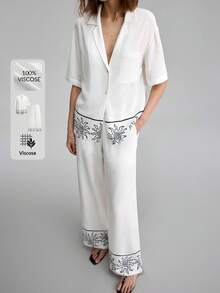 Ontre Blouse ample à imprimé soleil, floral et végétal peint à la main noir et blanc avec épaules tombantes, pantalon à taille élastique. Tenue bohème de plage, urbaine chic décontractée, de haute qualité pour l'aéroport, la croisière, les invités de mariage. Ensemble 2 pièces au look minimaliste de luxe, polyvalent - Noir et Blanc - Voir 6