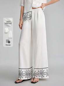 Ontre Blouse ample à imprimé soleil, floral et végétal peint à la main noir et blanc avec épaules tombantes, pantalon à taille élastique. Tenue bohème de plage, urbaine chic décontractée, de haute qualité pour l'aéroport, la croisière, les invités de mariage. Ensemble 2 pièces au look minimaliste de luxe, polyvalent - Noir et Blanc - Voir 8