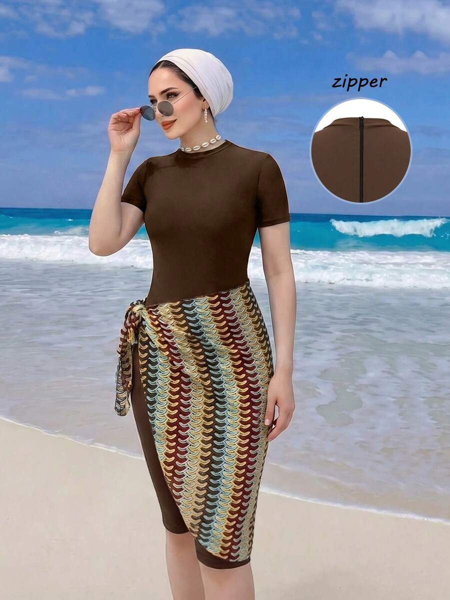 Swim Shayni Bộ đồ bơi liền thân kín đáo Shayni-D dành cho nữ, tay ngắn, màu cà phê, thiết kế khóa kéo, kết hợp với chân váy sarong lưới kẻ sọc buộc dây, thích hợp cho bãi biển, kỳ nghỉ thư giãn, hồ bơi, tiệc tùng. - Cà phê nâu - Xem 1
