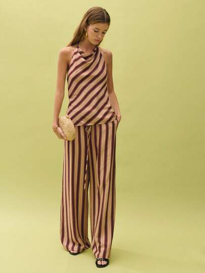 Nöista Brown Striped Sleeveless Top And Wide-Leg Pants Two Pieces Set Offers A Casual Yet Elegant Look. The Unique Contrast Between Diagonal And Vertical Stripes, Along With The Fitted High-Neck Sleeveless Design, Creates A Flattering Silhouette. The Soft And Comfortable Fabric Is Perfect For Spring And Summer, And Can Be Worn Alone Or As A Set. Suitable For Various Occasions Including Casual Outings, Vacations, And Parties.