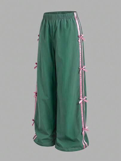 Pantalones casuales negros de corte holgado con decoración de lazo de cinta para niñas preadolescentes, ropa de calle versátil