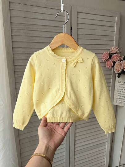 SHEIN Kids Girls' Solid Color Ruffle Cardigan, Casual Cute Drop Shoulder Bow Decor Round Neck Knit Sweater, Soft & Comfortable, Suitable For Daily Wear, Outdoor, Travel, Holiday, Home, Kindergarten, Play, School And More. Short Cardigan, Girls' Sweater, Girls' Ribbed Cardigan, Teen Cardigan, Ruffle Cardigan. Dress Shawl, Vest, Sun Protection, Air-Conditioned Room Cardigan, Yellow