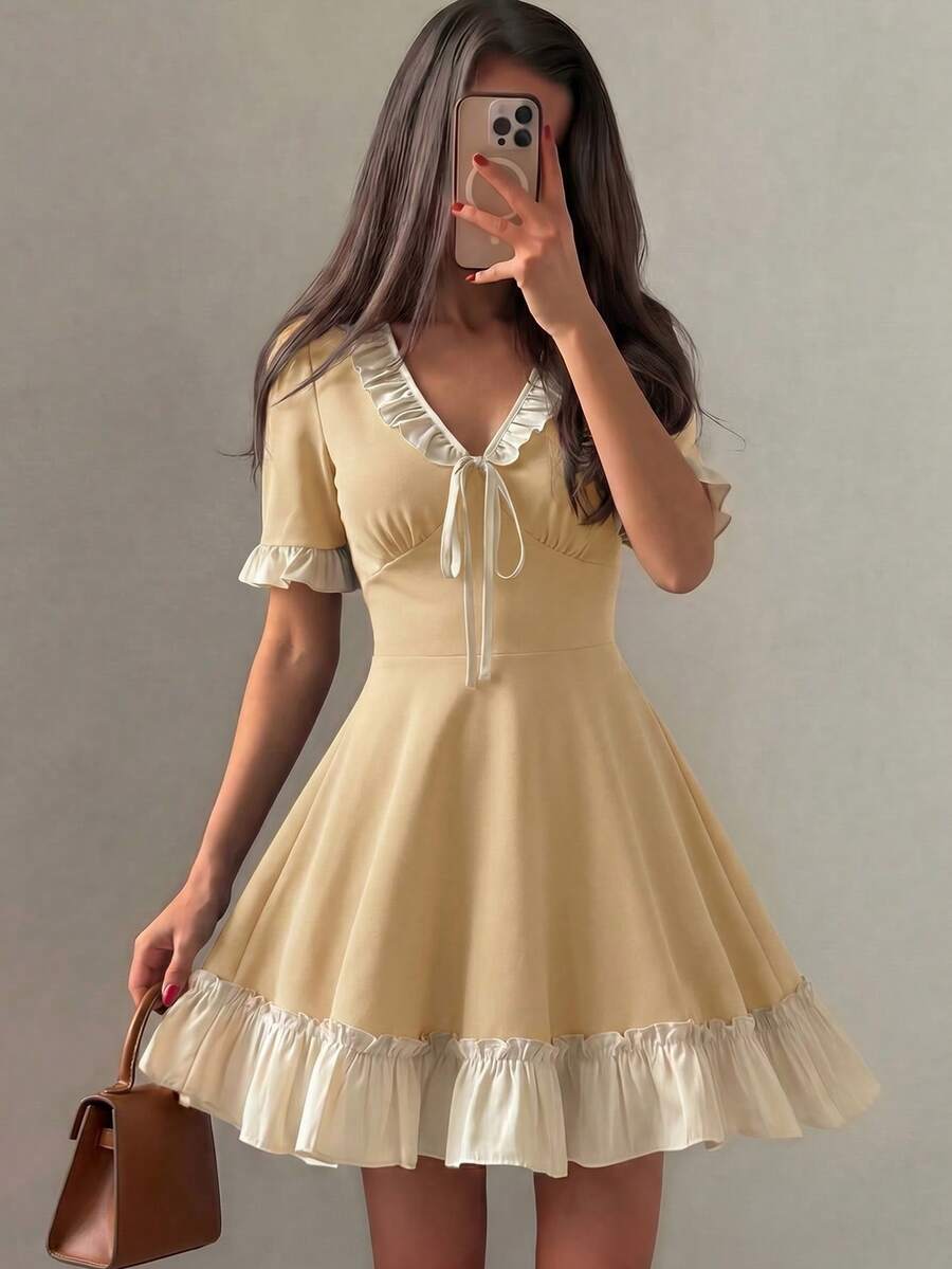 Mulvari Đầm nữ dệt kim đen ngắn tay phối patchwork gấu bèo dáng chữ A thanh lịch lãng mạn cho mùa xuân/hè - Màu vàng - Xem 1