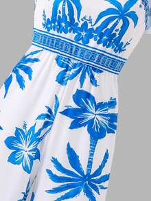 SHEIN Macacão bege claro com estampa floral vibrante em tons de vermelho-alaranjado e folhas verdes, que evoca um jardim primaveril cheio de vida. O decote quadrado realça os ombros e o colo, enquanto as mangas fluidas adicionam um toque dinâmico. A cintura marcada cria uma silhueta elegante, e o corte pantalona proporciona um caimento fluido e discreto. Ideal para férias na praia, chás da tarde no jardim ou passeios por feiras de artesanato, esta peça descontraída e ao mesmo tempo marcante exala uma vibe perfeita para as férias. - Multicolorido - Ver 7