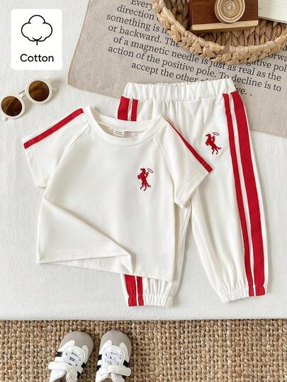 SHEIN Bộ đồ mùa xuân 2 món cho bé gái, kiểu dáng thường ngày năng động và thoải mái, thêu họa tiết, gồm áo tay phồng ngắn cổ tròn và quần dài kẻ sọc.