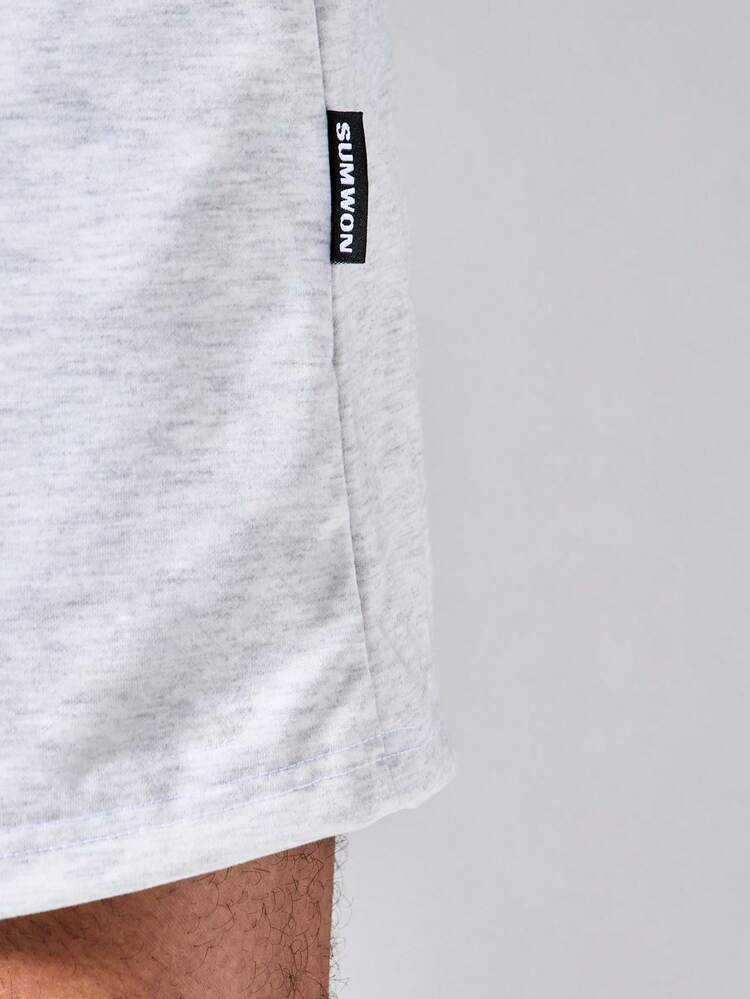 Short en maille chiné avec cordon de serrage à la taille, poches latérales et détail d'étiquette de marque, pour l'été