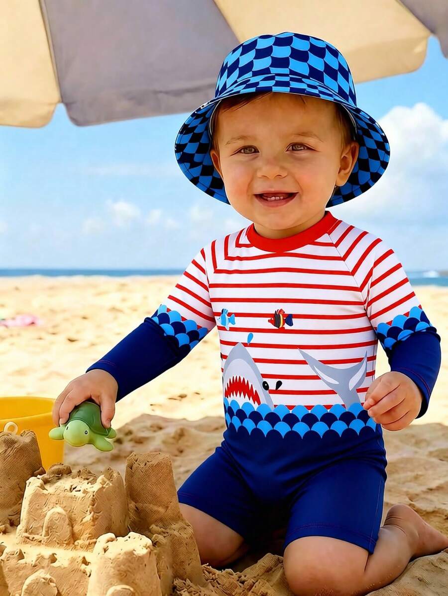 SHEIN Bộ đồ bơi liền thân dài tay in hình cá mập hoạt hình dễ thương dành cho bé trai, kèm mũ chống nắng, thích hợp cho kỳ nghỉ hè, bãi biển, lướt sóng, công viên nước. - Nhiều màu - Xem 1
