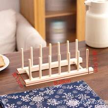 1 chiếc kệ đựng chén đĩa bằng gỗ, dùng cho sinh hoạt hàng ngày, giải trí tại nhà. Chất liệu gỗ dễ vỡ; vui lòng cẩn thận khi sử dụng! - Thông 7 cột 6 ô vuông 28cm - Xem 6