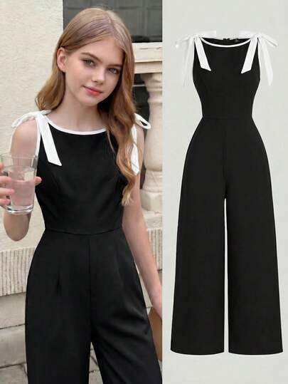 SHEIN Girlism Bộ áo liền thân/áo liền quần cho bé gái tuổi teen, cổ tròn, không tay, màu đen với viền tương phản, trang trí nơ, thiết kế eo thon và chân váy xòe – Phong cách cổ điển, sang trọng, phù hợp cho công sở, đi học, hẹn hò, tiệc tùng, lễ hội và sinh nhật.