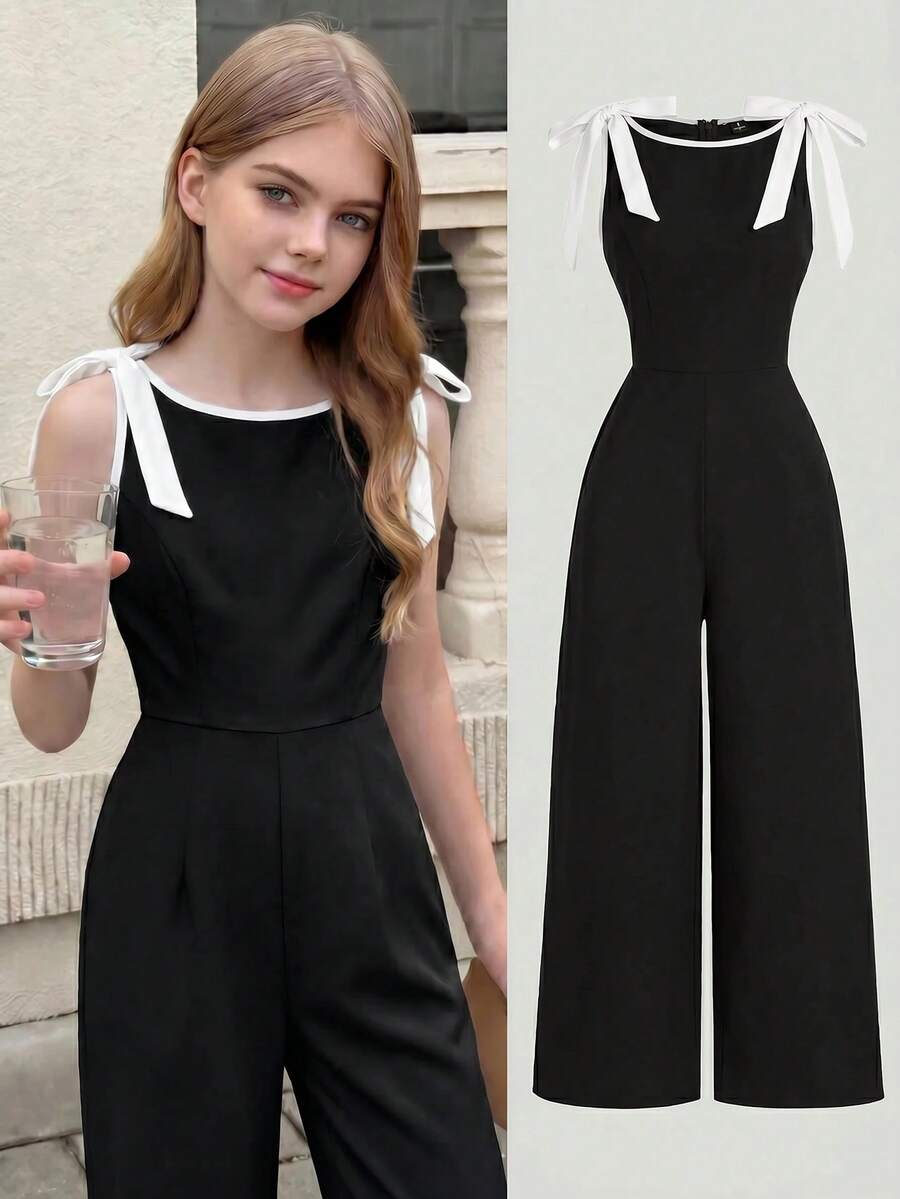 SHEIN Girlism Bộ áo liền thân/áo liền quần cho bé gái tuổi teen, cổ tròn, không tay, màu đen với viền tương phản, trang trí nơ, thiết kế eo thon và chân váy xòe – Phong cách cổ điển, sang trọng, phù hợp cho công sở, đi học, hẹn hò, tiệc tùng, lễ hội và sinh nhật. - màu đen - Xem 1
