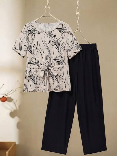 Rusticease Conjunto informal de blusa de manga corta con cuello redondo y estampado floral, y pantalones para mujeres de edad media y mayores