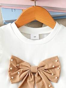 Elladie kids 4-7岁女童两件套：可爱蝴蝶结装饰串珠短袖上衣和松紧腰串珠开衩短裤，适合日常生活、派对和其他场合。 - 杏色 - 查看 4