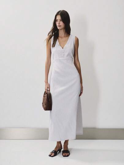 Nöista Sleeveless Midi Dress With V Neckline And Ruffle Detail In Checks Fabric. Festival, Outfit, Casual, Graduation.