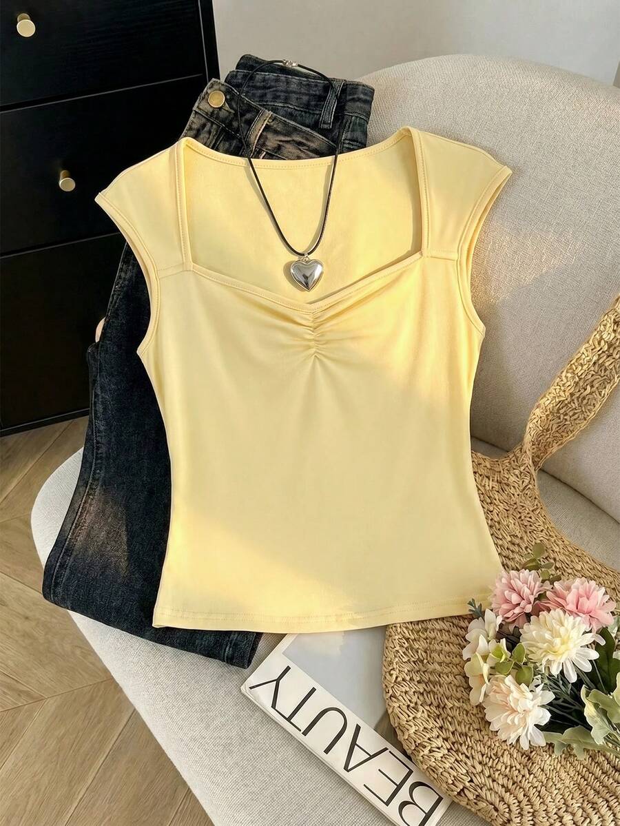 SHEIN Áo thun ngắn tay ôm sát màu xanh navy cho bé gái tuổi teen, chấm bi đen trắng, xếp ly, phong cách ngọt ngào thường ngày, phù hợp cho kỳ nghỉ hè, đi học, dã ngoại gia đình, mặc hàng ngày. - Màu vàng - Xem 1
