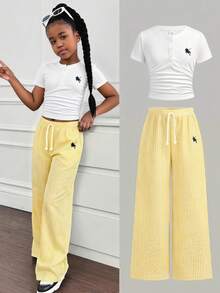 Bộ đồ thường ngày cho bé gái tuổi teen: áo thun trắng cổ tròn ôm sát và quần ống đứng, màu vàng & trắng. - Màu vàng - Xem 1