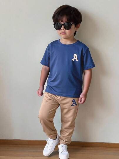 SHEIN Young Boy Letter Print Blue Short Sleeve T-Shirt And Khaki Casual Pants Set