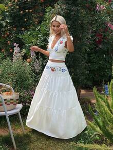 Conjunto informal de 2 piezas para mujer con blusa bohemia de cuello en V con volantes y estampado floral, y falda larga de paraguas - Blanco - Ver 9