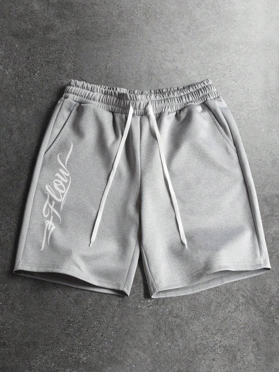STYNVO Quần short nam in chữ, cạp chun có dây rút và túi. - Màu Xám nhạt - Xem 1