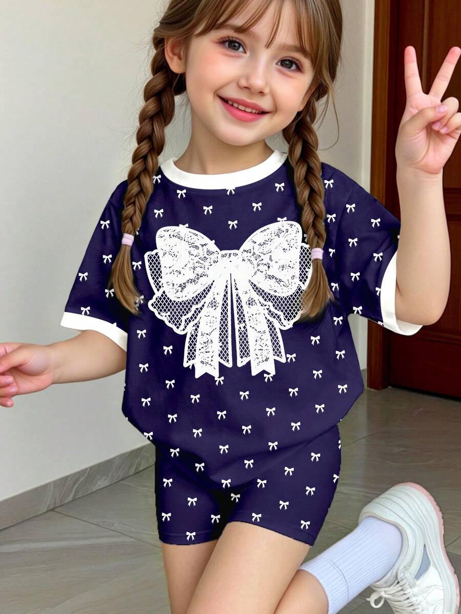 春夏少女休闲时尚创意个性清新可爱简约藏蓝色底白色蝴蝶结蕾丝蝴蝶图案印花夏季休闲度假风基础款短袖T恤和骑行短裤套装,舒适日常运动装,适合春夏少女的氛围穿搭,套装 - 彩色 - 查看 1