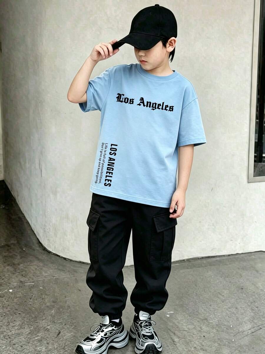 青少年男孩酷炫图案英文印花圆领短袖T恤和工装裤套装,适合节日、派对、春夏穿着,轻便舒适,时尚休闲,适合街头、户外、校园、度假等场合,也是馈赠佳品。 - 彩色 - 查看 1