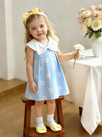 Souflis Vestido informal y elegante para niña pequeña con estampado de margaritas azul colegial, sin mangas, con decoración de lazo blanco en el cuello, para verano