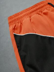 Manfinity ZONE917 Pantalones cortos con cordón en la cintura, estampado de letras y parches de colores contrastantes para hombres - Naranja - Ver 5