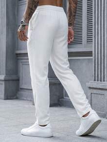 Manfinity CasualCool 男士休闲弹力腰侧袋铆钉设计锥形裤，适合日常休闲穿着、周末外出、旅行、朋友聚会等场合。这款裤子是男士衣橱中不可或缺的百搭单品，也是送给男友或丈夫的绝佳礼物。 - 白色 - 查看 2