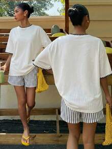 Muchica Áo thun nữ màu trắng dáng rộng, chất liệu 34% cotton, kiểu dáng tối giản, thêu hình vỏ sò – Cổ tròn, tay ngắn, dáng suông thoải mái, phong cách mùa hè dễ thương, dịu dàng, sạch sẽ, mang hơi hướng Y2K cổ điển, hoàn hảo cho kỳ nghỉ xuân/hè, du lịch, lễ hội miền Tây, hẹn hò, tiệc trà chiều, mặc nhà thoải mái và đi học. - trắng - Xem 6