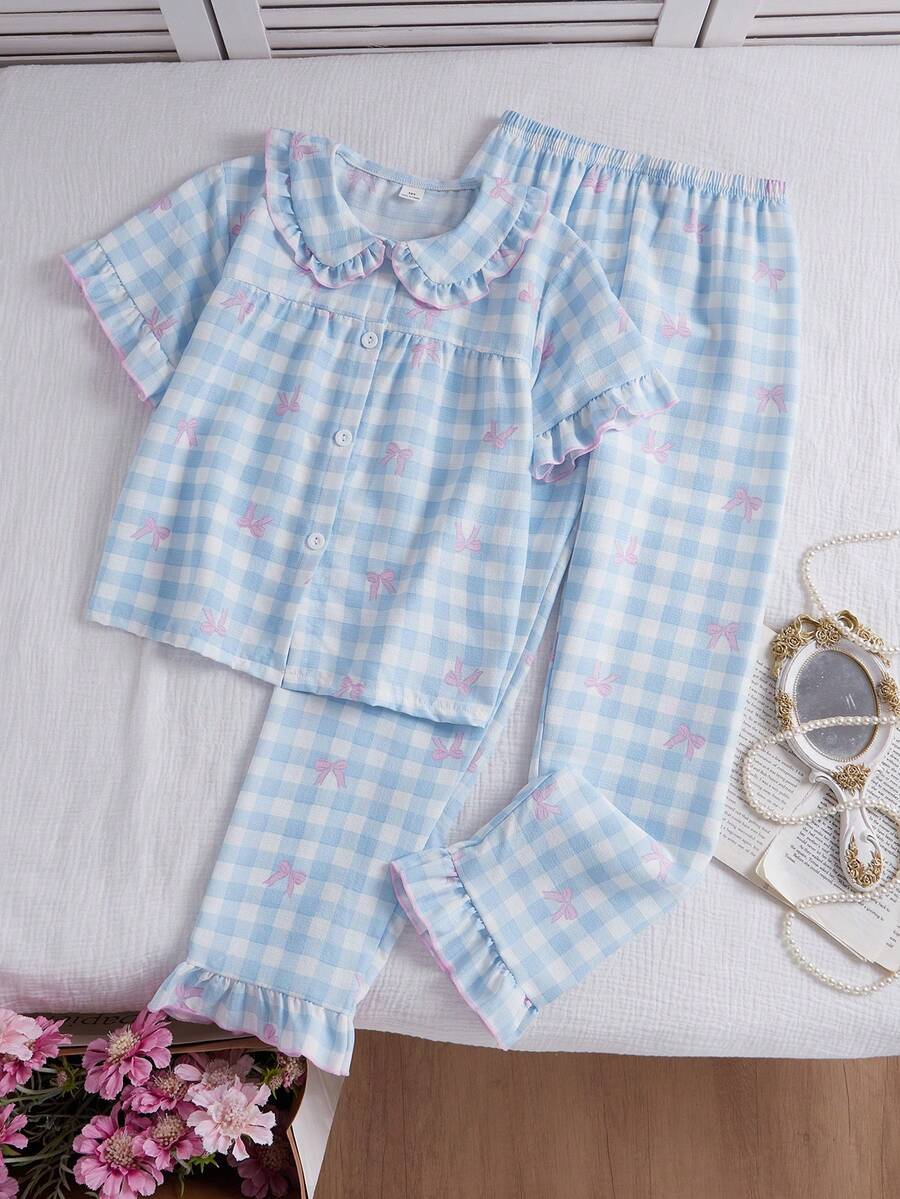 Bộ đồ ngủ 2 mảnh phong cách ngọt ngào dành cho bé gái tuổi teen: Áo cardigan tay ngắn in họa tiết kẻ caro và nơ, kèm quần ống rộng viền bèo nhún. - Nhiều màu - Xem 1