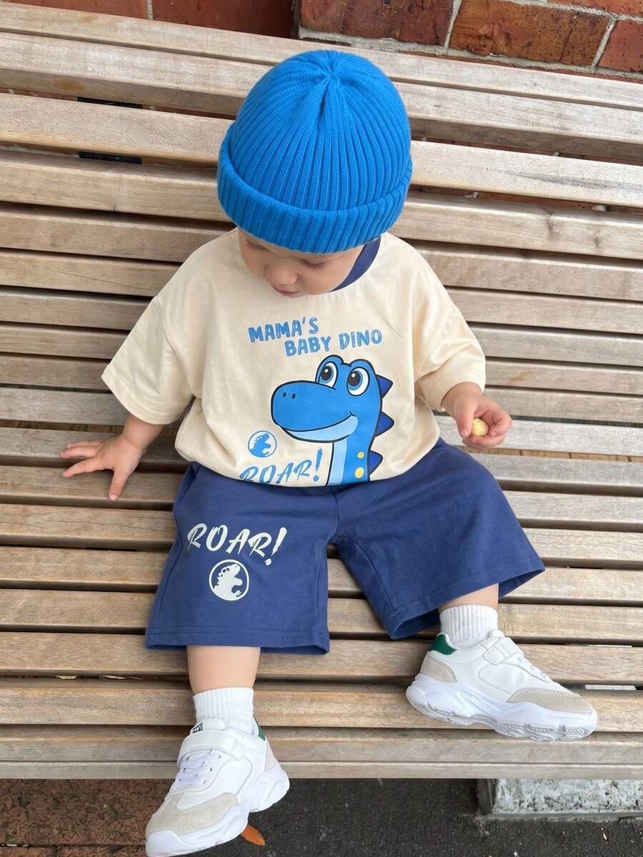 SHEIN Bộ 2 món áo thun ngắn tay và quần short in hình khủng long dễ thương cho bé trai/bé gái, trang phục mùa hè cho bé trai. - Màu xanh lam - Xem 1