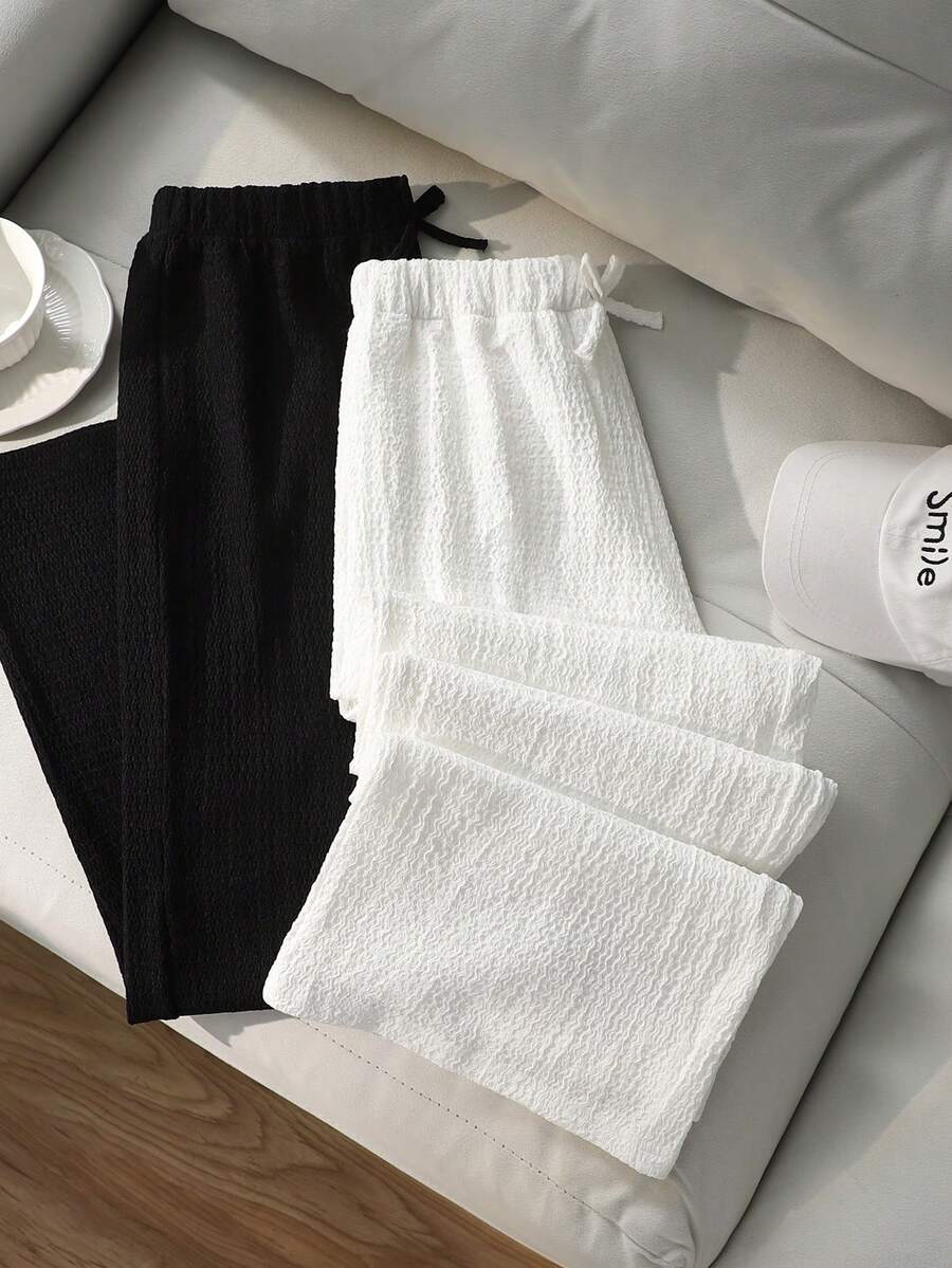 SHEIN 2件組女孩極簡時尚親膚舒適泡泡克雷普面料蝴蝶結裝飾寬鬆寬腿褲,黑白配色,日常基本款,夏季兒童直筒褲,經典黑白設計,簡約休閒,適合通勤,法式優雅風,寬鬆版型,夏季新品 - 黑與白 - 查看 1