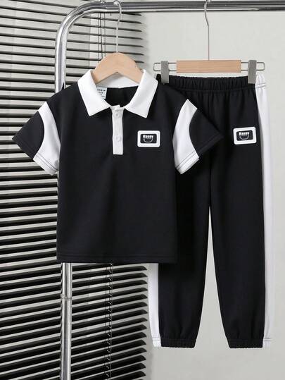 SHEIN Streecool Kids Bộ 2 món áo polo và quần dài cho bé trai, dáng rộng, phối màu độc đáo, phù hợp cho mặc hàng ngày, đi chơi, dự tiệc, tụ họp và phong cách đường phố.