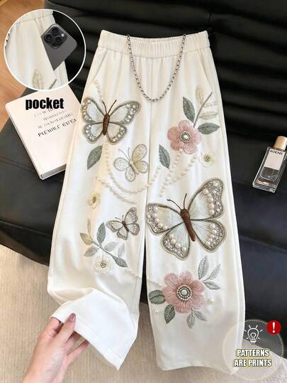 SHEIN Franclia Quần ống rộng xếp ly kiểu Trung Quốc mới dành cho nữ, in họa tiết bướm và hoa.
